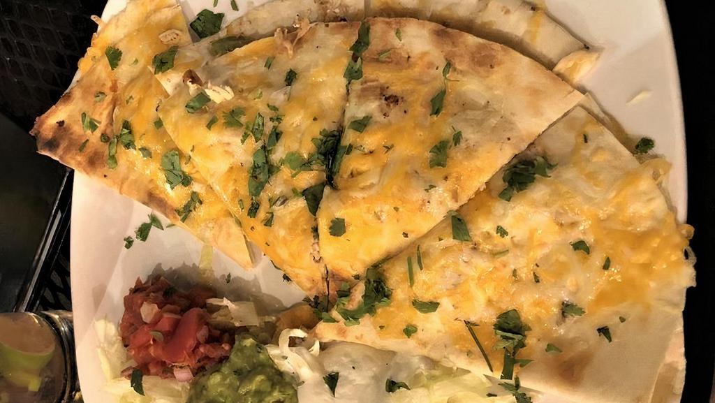 Chicken Quesadilla · Shredded chicken breast grilled peppers and onions cheddar jack cheese, served with salsa, guacamole, and sour cream.