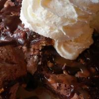 Brownie A La Mode · Warm chocolate brownie with vanilla ice cream. Topped with chocolate and caramel sauce