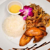 Vaca Frita · Boiled then pan seared crispy beef, topped with sautéed garlic and onions, next to maduros, ...
