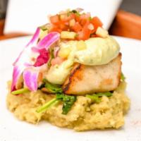 Tropical Sea Bass · Over sweet White mashed potatoes, spinach, mushrooms. Topped with avocado nioli and pineappl...
