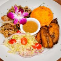 Pernil Rostisado · Roasted pork shoulder, potato cake, maduros lettuce topped with tomatoes and red onions.