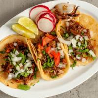 Taco · Double soft corn tortillas with choice of meat, onion and cilantro.