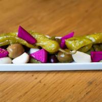 Plate Of Pickles · pipara peppers, garlic, olives, conichons, carrots, fennel pollen (vegan, gluten-free)