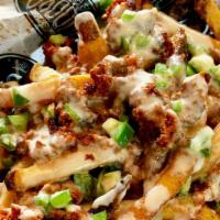 Chorizo Cheese Fries · Fries topped with chorizo cheese sauce and jalapenos.