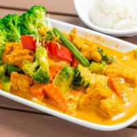 Panang Curry · With coconut milk and kaffir lime leaves.