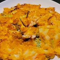 Seafood Pancake · Korean style pizza. With shrimp, squid and vegetables.