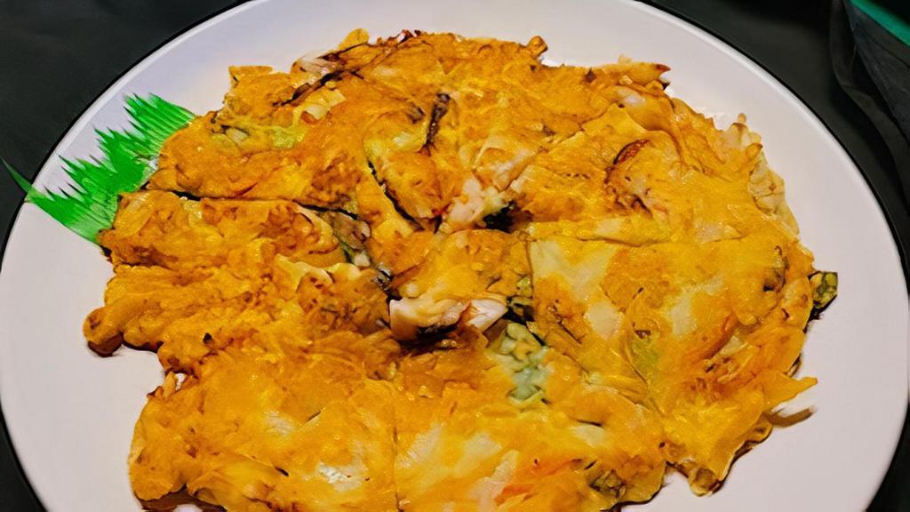 Seafood Pancake · Korean style pizza. With shrimp, squid and vegetables.