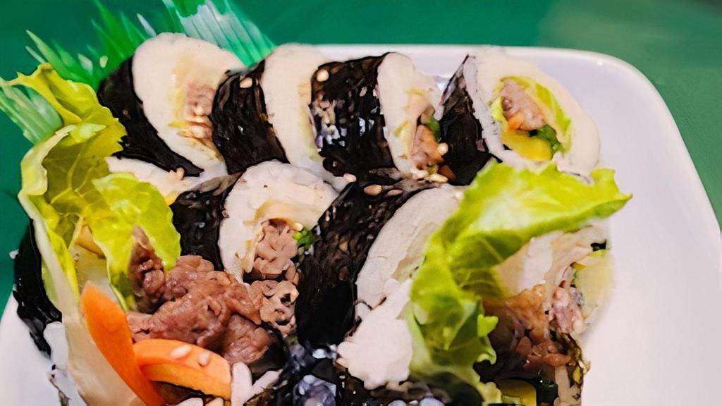 Bulgogi Kimbop · Korean sushi roll with BBQ beef bulgogi, fish cakes, carrots, spinach and daikon.