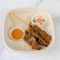 Beef Satay  · Skewered beef marinated in Thai blend of herbs and spices, slow-grilled and brushed with coc...