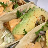 Fish Tacos · 3 tacos-cod fish , lightly tossed in corn flour and fried topped with cucumber relish, chipo...