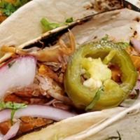 Cochinita Pibil Tacos · sour orange braised pork butt with achiote, fresh red onions, cilantro and jalapeño