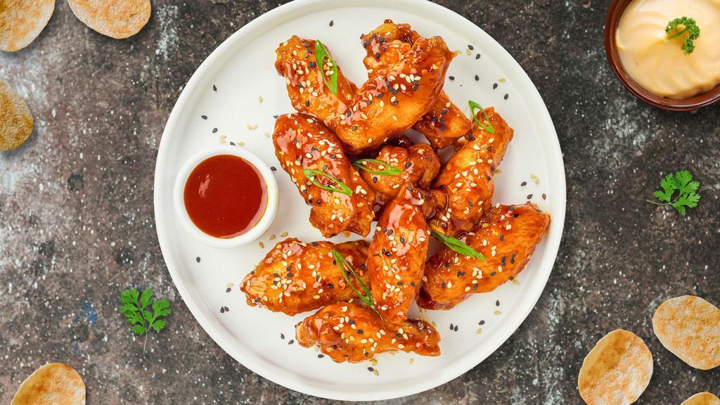 S&S Wings · Fresh chicken wings breaded, fried until golden brown, and tossed in sweet and sour sauce. Served with a side of ranch or bleu cheese (6 pieces).