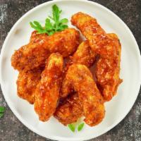 Smoking Bbq Tenders · Chicken tenders breaded and fried until golden brown before being tossed in barbecue sauce (...