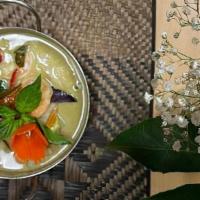 Green Curry · Green curry paste with coconut milk, bamboo shoots, bell peppers and Thai basil