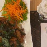 Crispy Chicken Basil · Chicken breast marinated with Thai herbs, breaded and sauteed with chili sauce, garlic, red ...