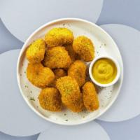Get That Chicken Nugget · Bite sized nuggets of chicken breaded and fried until golden brown. Served with your choice ...
