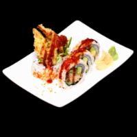 Spider Roll · Soft shell crab tempura, cucumber and avocado on the inside, topped with tobiko and eel sauce.