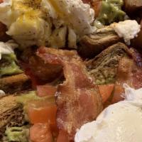 California Benedict · 2 Poached eggs, avocado spread, sliced tomato and applewood smoked bacon served on grilled E...