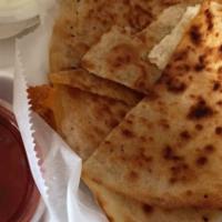 The 3 Cheese Quesadilla · Served with sour cream and salsa.