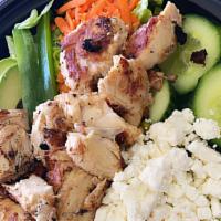 Greek Salad With Grilled Chicken · Garden salad topped with feta cheese and black olives.