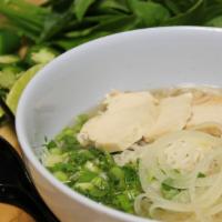38 - Chicken Pho · Flat rice noodles with chicken in beef/chicken broth with toppings; garnished with yellow on...