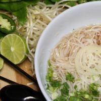 39 - Plain Pho · Flat rice noodles in beef/chicken broth with toppings; garnished with yellow onions, scallio...