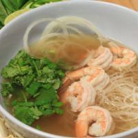 41 - Shrimp Pho · Five shrimps. Flat rice noodles in beef/chicken broth with toppings; garnished with yellow o...