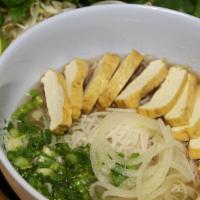 40 - Tofu Pho · Tofu. Flat rice noodles in a vegan broth; garnished with yellow onions, scallions, cilantro,...