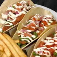 Fish Tacos  · Deep fried battered rockfish topped with lettuce, chimichurri sauce, crema and pico de gallo...