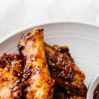 Wings With Garlic Sauce · Hot & Spicy. Eight pieces.