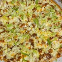 Chicken Ranch Pizza · Crispy chicken, bacon, tomatoes and buttermilk ranch topped with shredded lettuce.
