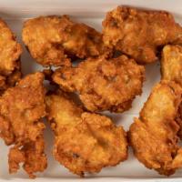 Chicken Wings · Deep-fried chicken wings with your choice of sauce. Add dressing for an additional charge.