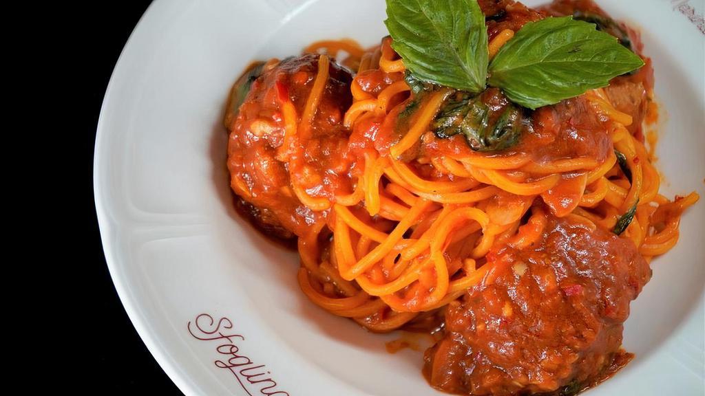 Spaghetti And Meatballs · You can't mess with the classics! Spaghetti with nonna palmina's meatballs.. Contains: Dairy, Gluten, Allium, Nightshade, Egg, Pork