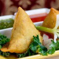 Vegetable Samosas · Vegan. Pastry stuffed with peas, potatoes, herbs and spices.