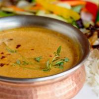 Korma · Exquisitely Blended Spices & Herbs Mild Sauce in Onions & Dressed w/ Cream