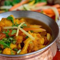 Vegan Aloo Gobi · Cauliflower and potatoes cooked in herbs and spices. Vegan.