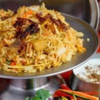 Chicken Biryani · Basmati Rice w/ Chicken in Blend of Herbs & Spices