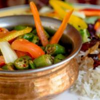 Vegan Bhindi Masala · Okra cooked in a wok with dry seasonings and herbs. Vegan.