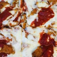 Chicken Parmigiana Sicilian Pizza · Sicilian pizza layered with pieces of chicken cutlet, traditional sauce and mozzarella cheese.