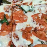 Margherita White Sicilian Pizza · Pizza topped with ricotta cheese, sliced tomatoes, spinach or broccoli, mozzarella cheese an...