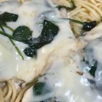 Chicken Florentine · Chicken in a white wine lemon sauce with spinach over spaghetti, topped with mozzarella chee...