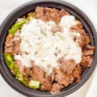 Steak & Lamb Gyro Bowl · Romaine, feta, tomato and cucumber salad, sumac onions and tzatziki.