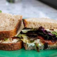The Safehaven · Herbed goat cheese, cheddar, avocado, roasted tomato, artichoke hearts, greens