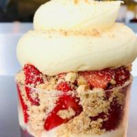 Strawberry Blonde · Strawberry cheesecake ice cream with a frosted red velvet cake core, topped with strawberrie...