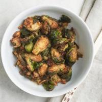 Szechuan Brussels Sprouts · crispy brussels sprouts wok-seared in our house szechuan chili oil
