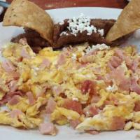 Jamon & Huevo · Ham & Eggs Breakfast platter with sour cream, queso fresco, refried beans and two corn torti...