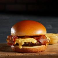 Bacon Cheddar Cheesy Burger · 1/2 lb of Fresh Angus Beef topped with bacon and covered in hot cheddar cheese sauce.