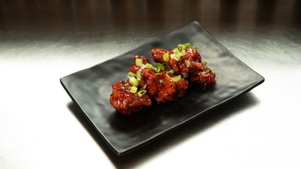 Korean Bbq Wings · Twice fried chicken wings with homemade sweet and spicy glaze. Halal certified.