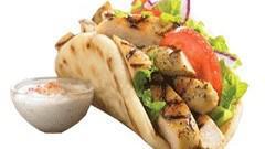 Chicken Gyro · Grilled chicken, red onions, roma tomatoes, ranch sauce, pita bread, lettuce.