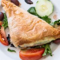 Spanakopita · Spinach and feta cheese pie. Served with pita bread.